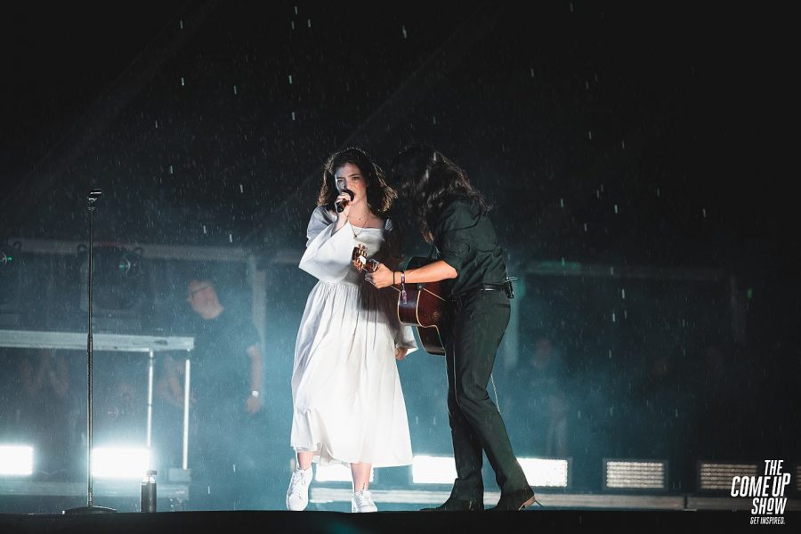 Lorde performing The Louvre at the Osheaga Festival in Montreal, Canada with a guitarist