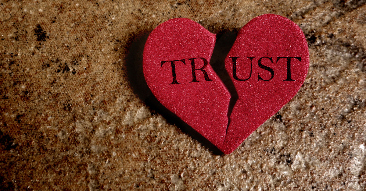 Broken red Trust heart, on textured background